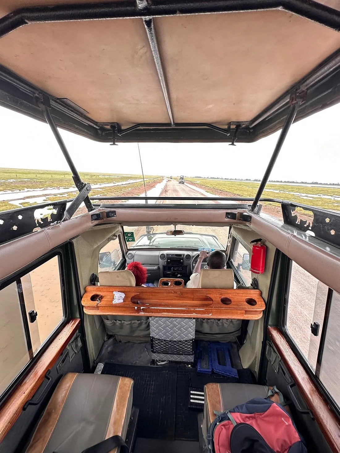 View from inside a safari vehicle on a wet track